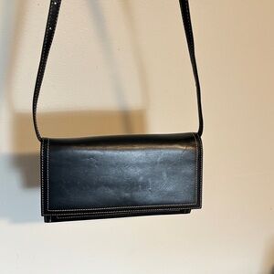 SAK black leather crossbody clutch